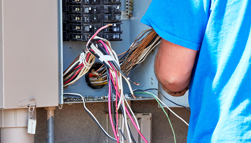 Expert Electrician Rewiring a Home